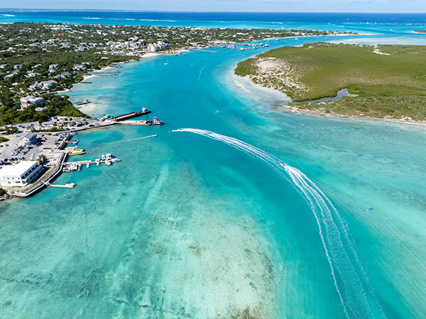 Drone shot of jetskis entering marina in Leeward