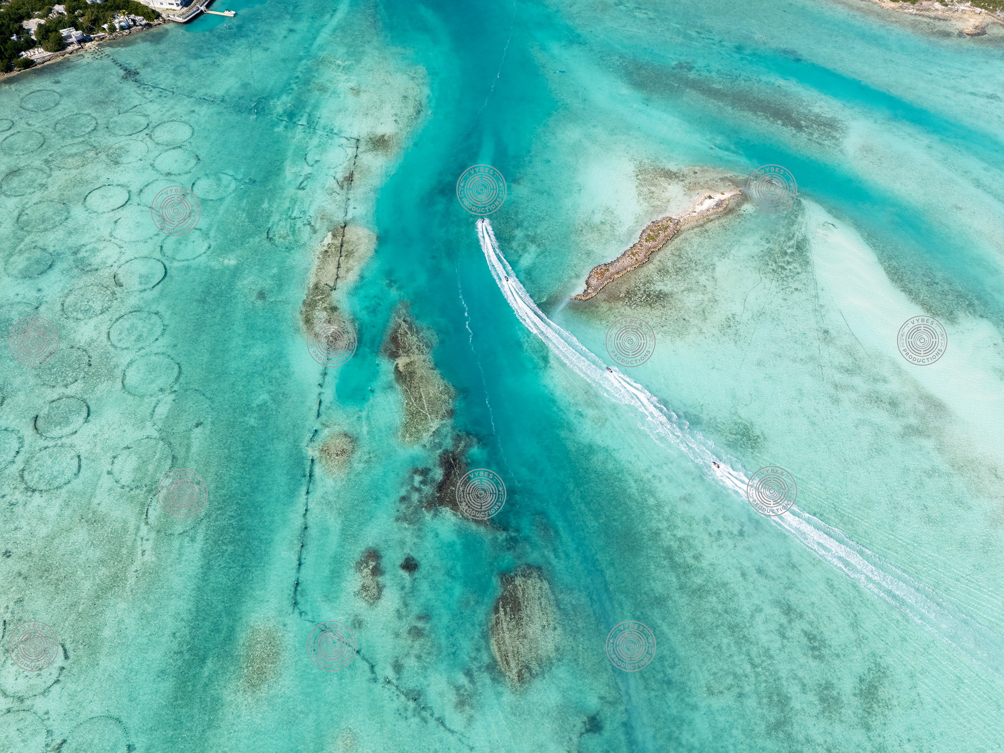 Jetskis going by Conch Farm Pools near Leeward