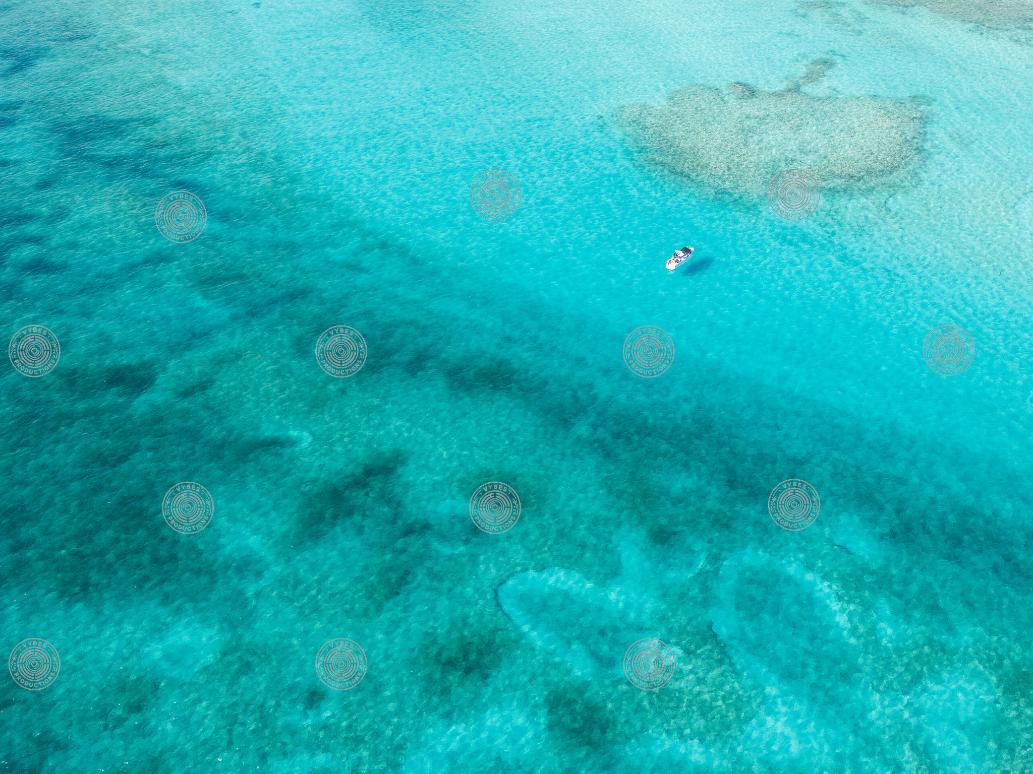 Drone shot of boat in Grace Bay waters