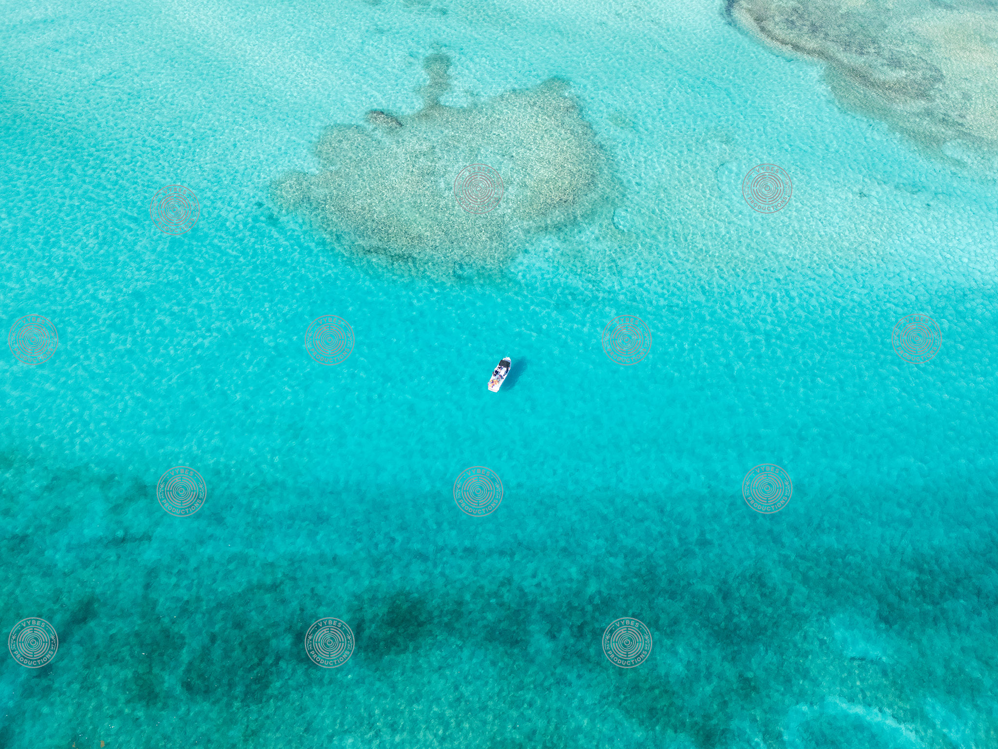 Drone shot of boat in Grace Bay waters