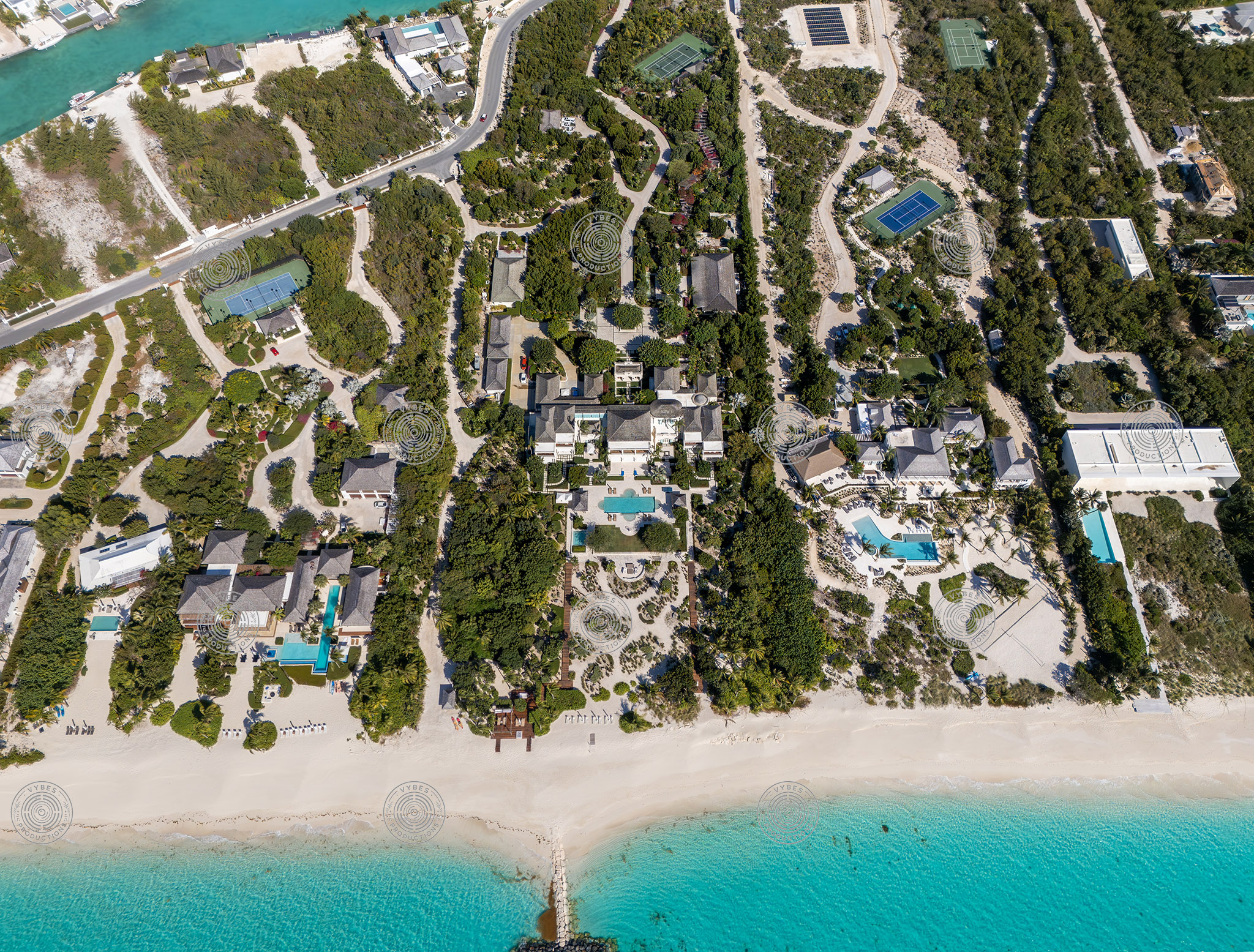 Overhead shot of beachfront estates and groines in Leeward