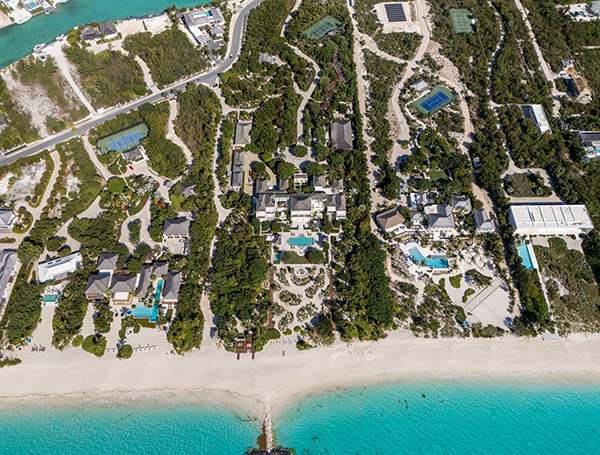 Overhead shot of beachfront estates and groines in Leeward