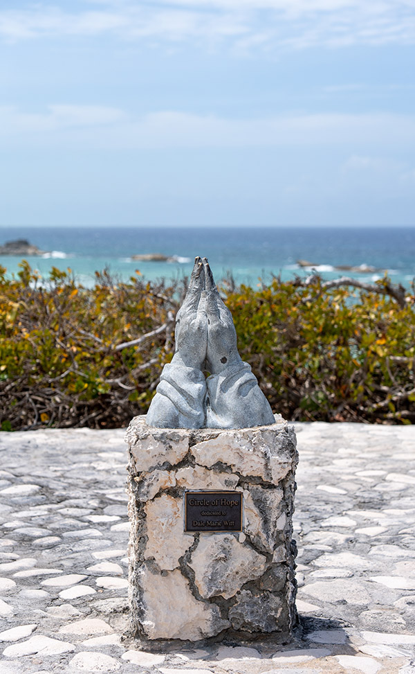 Circle of Hope (Praying Hands) statue in Mudjin Harbor, Middle Caicos