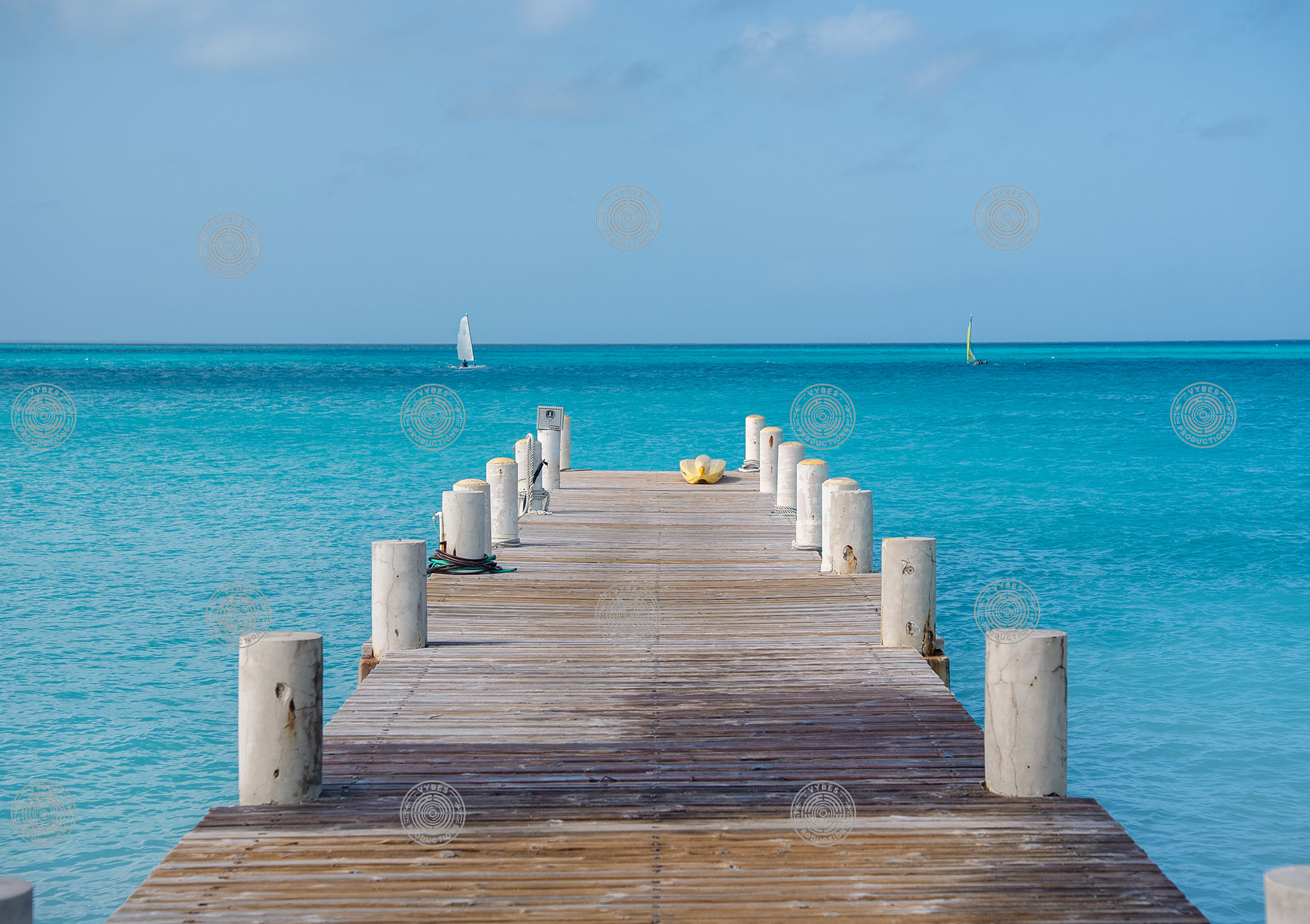 Wooden dock with yellow kayak near Rickies