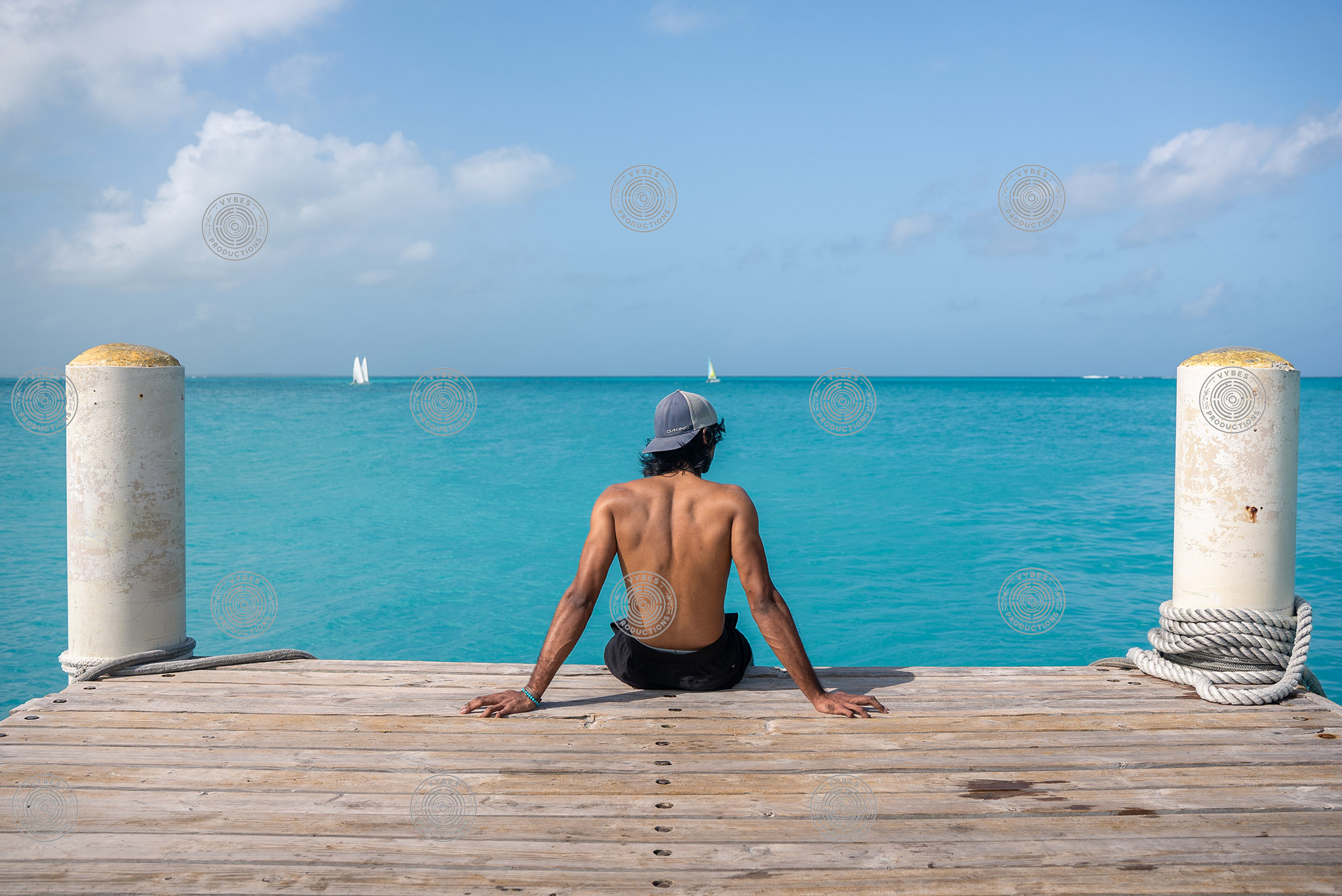 Tourist looking out into Grace Bay waters near Rickies