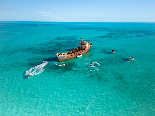 Jet skis and boats around La Famille Express shipwreck