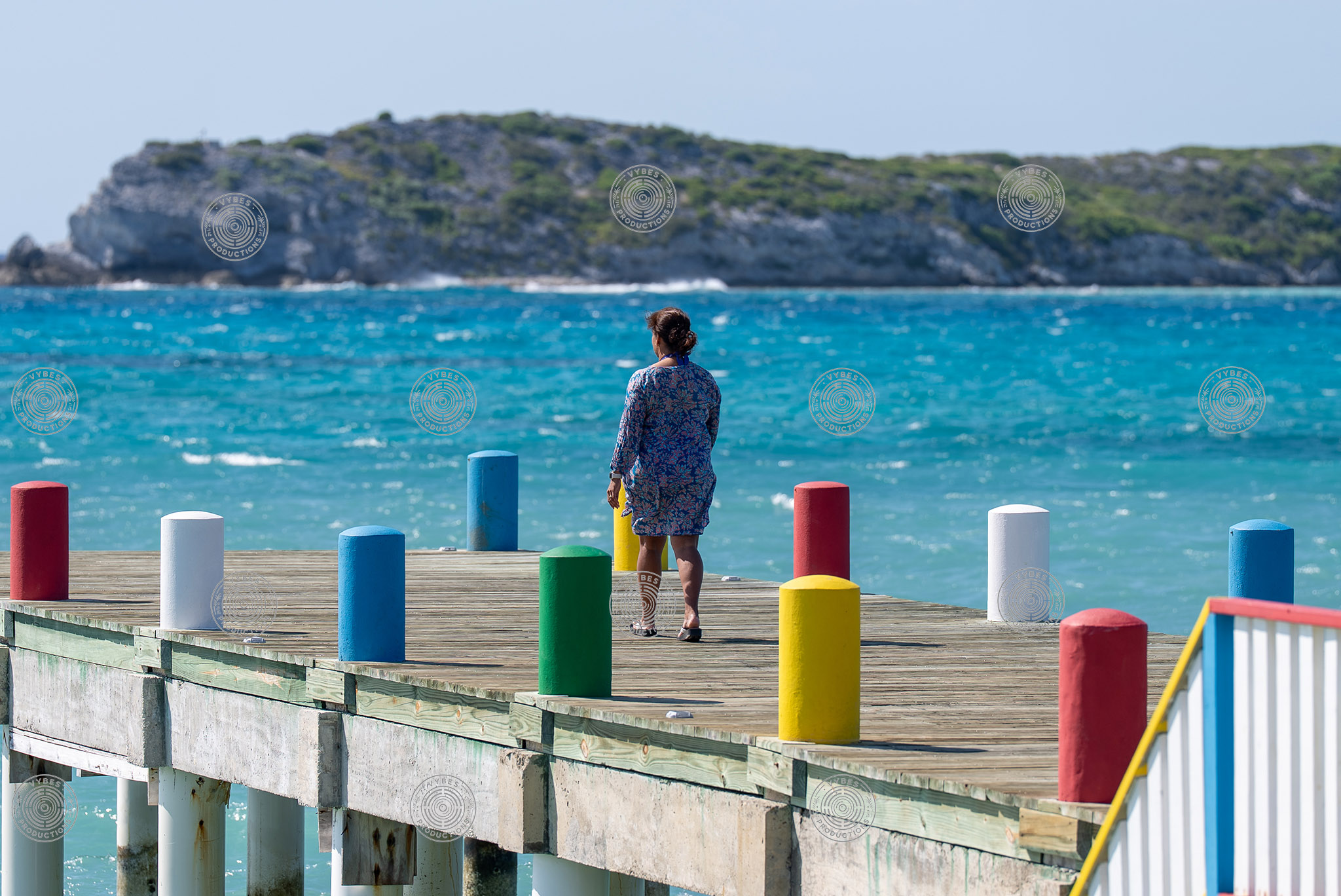 Handheld shot of tourist walking along dock in South Caicos