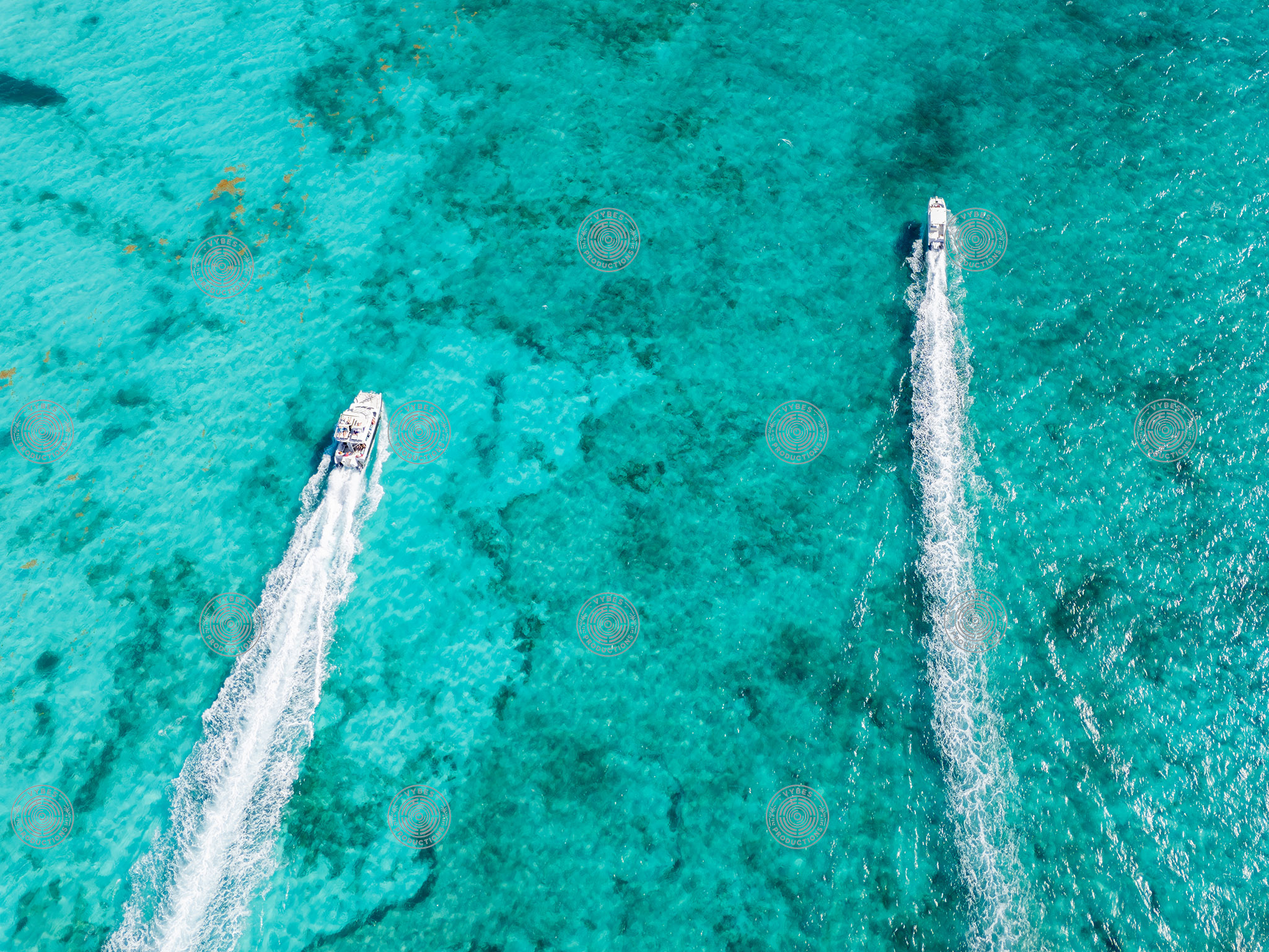 Drone shot of two boats cruising near Grace Bay Beach