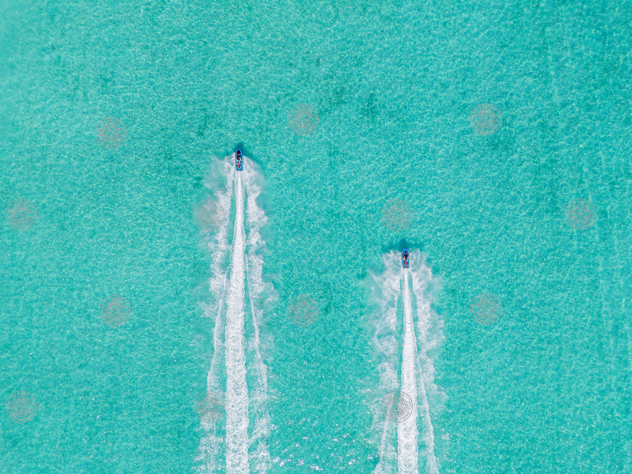 Two Jet Skis Leaving Parallel Wake Trails in Long Bay