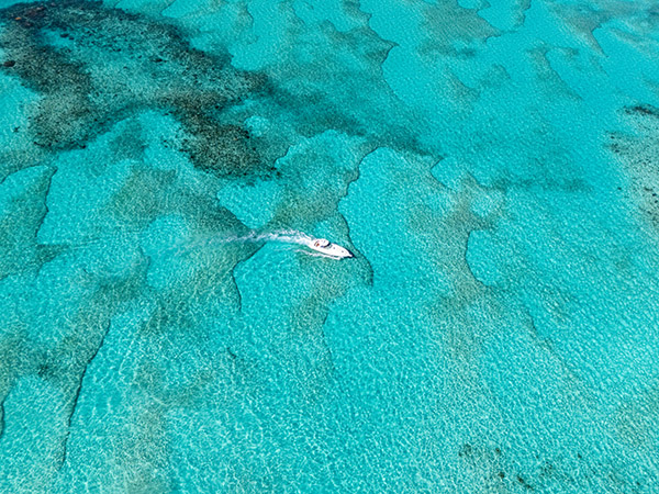 Drone shot of yacht cruising