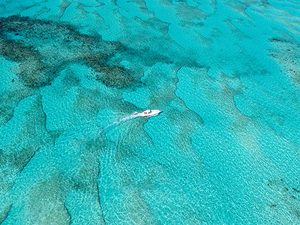 Drone shot of yacht cruising