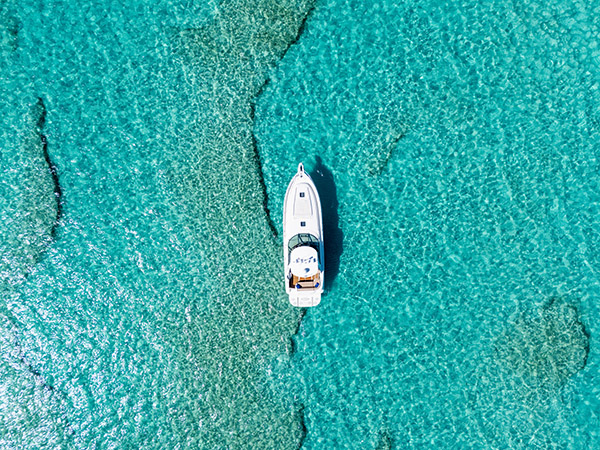 Drone shot of yacht cruising