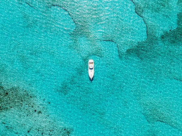 Drone shot of yacht cruising