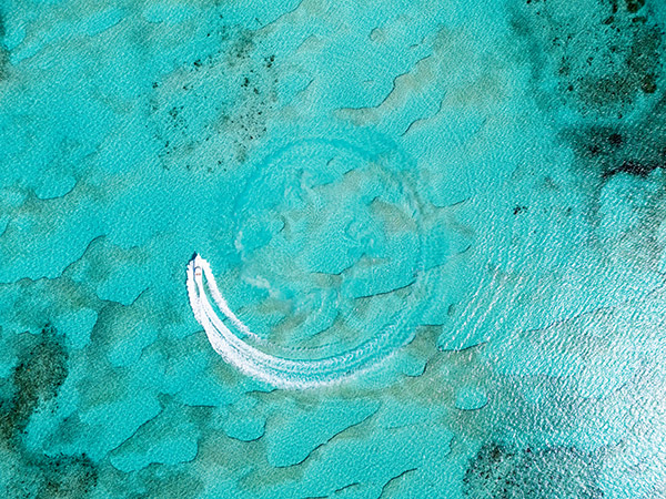 Drone shot of yacht cruising