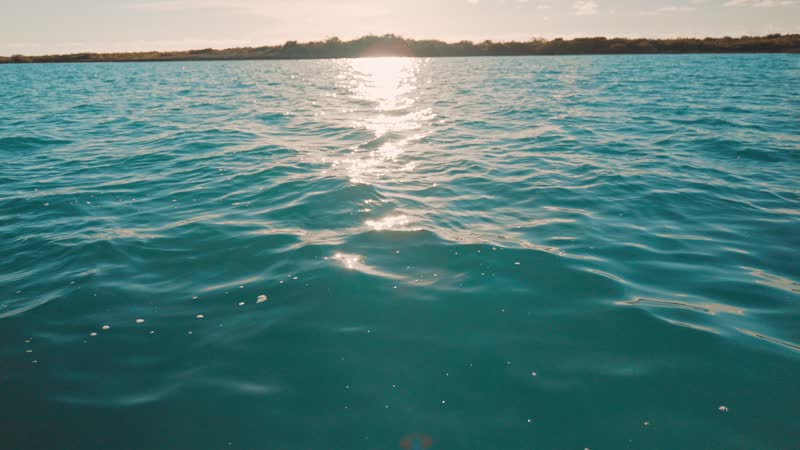 Slow-motion static shot of still Grace Bay water