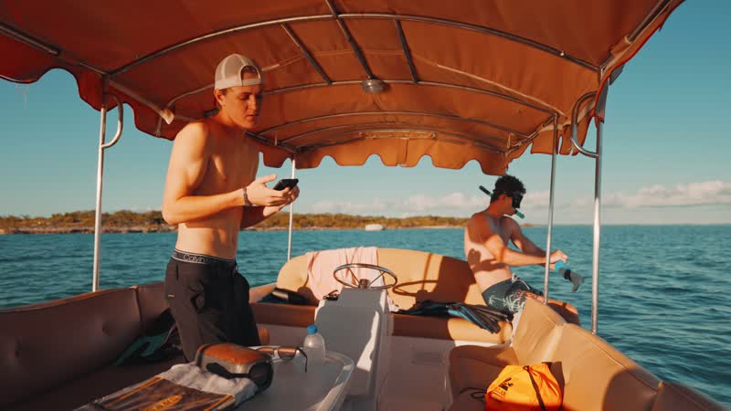 Slow-motion shot of boaters dancing on boat
