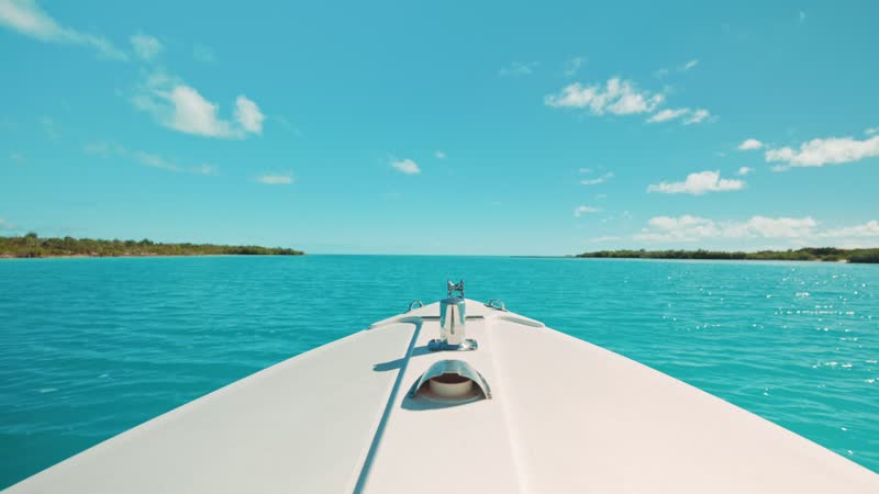 Handheld stationary shot of bow of boat cruising