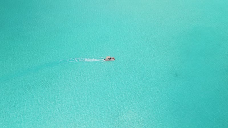 Aerial view of tiki boat in Chalk Sound