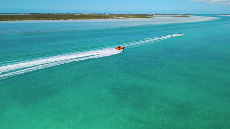 Dynamic drone shot of jetcar and jetski