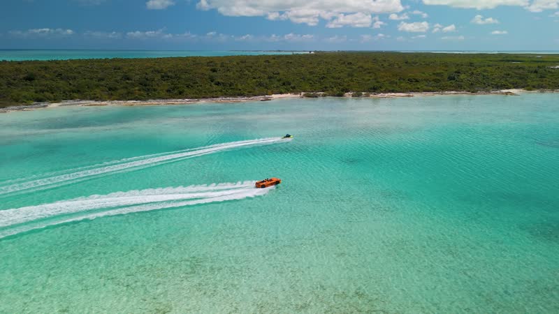 Dynamic drone shot of jetcar and jetski