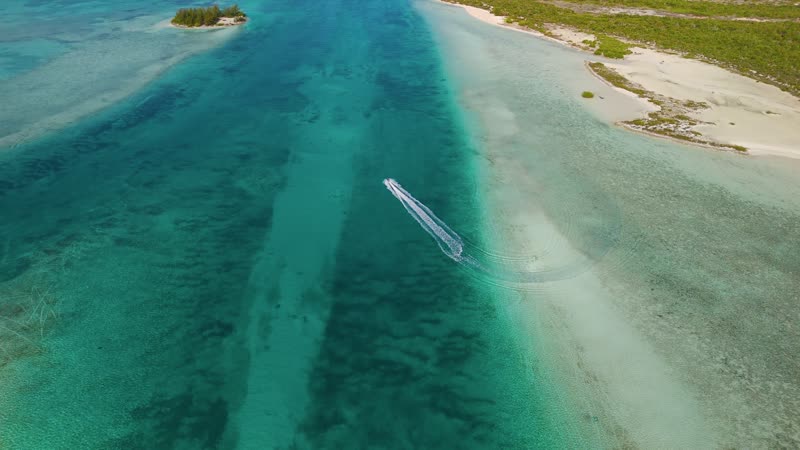 Expansive drone shot of jetski near Star Island