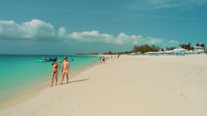 Handheld shot walking along Grace Bay Beach