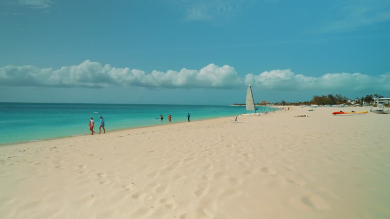 Handheld shot walking along Grace Bay Beach