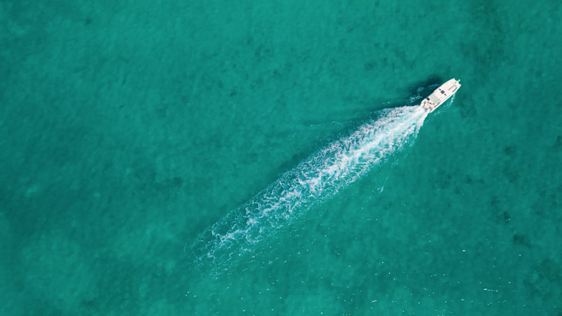 Top down view of hobiecat and boat in Grace Bay waters