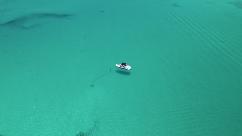 Aerial view of anchored boat off of Grace Bay Beach