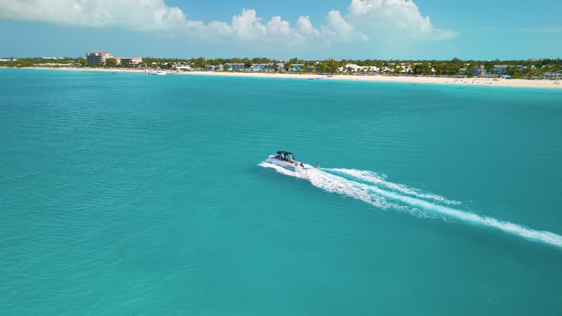 Drone shot of tourist boat off of Grace Bay Beach