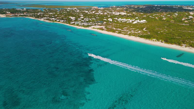 Drone shot of boats cruising near Leeward area of Grace Bay Beach