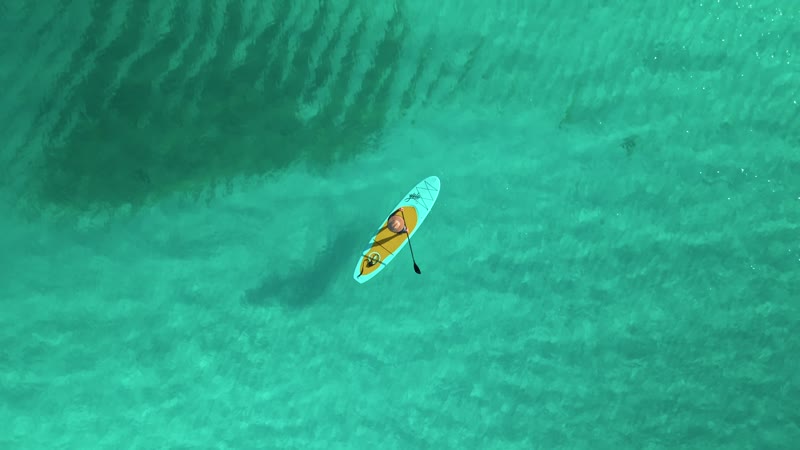 Drone shot of paddleboarder near Grace Bay Beach