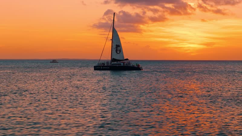 Dynamic sunset shot of luxury catamaran