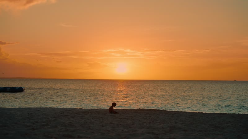 Slow-motion sunset shot of quiet Grace Bay Beach