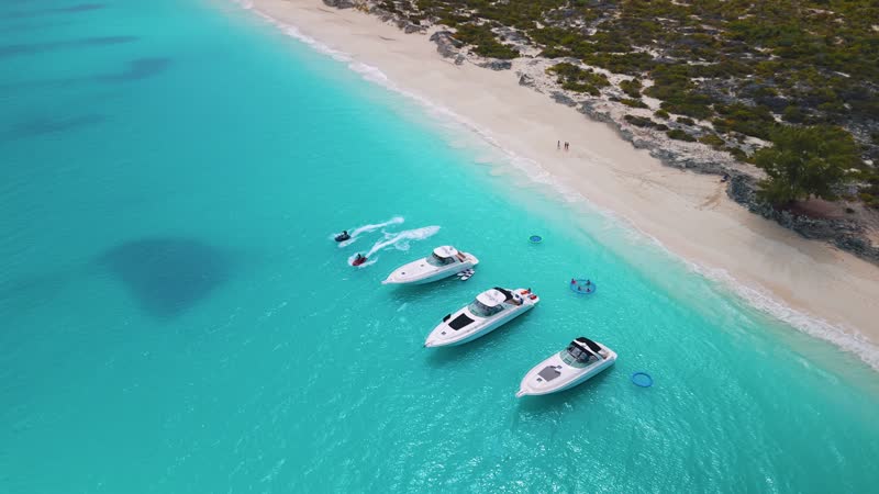 Aerial view of luxury yachts and jetskiis near Halfmoon Bay