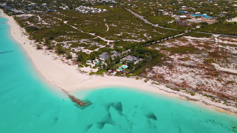 Panning drone shot of luxury villas in Leeward