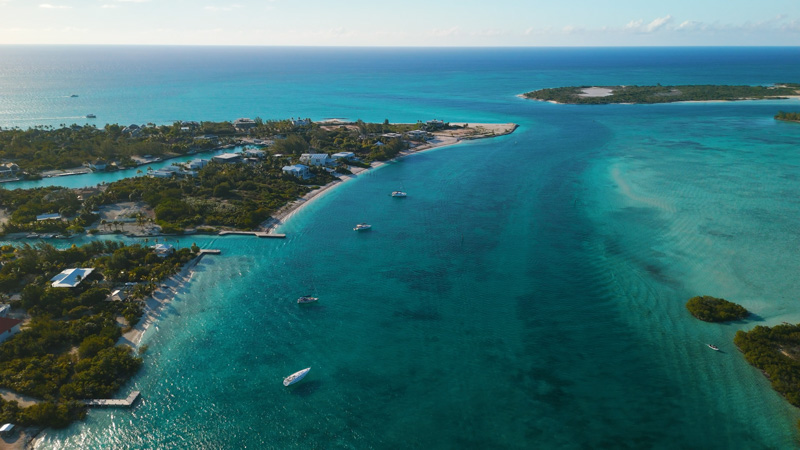 Panning drone shot of boats situated along Leeward Channel