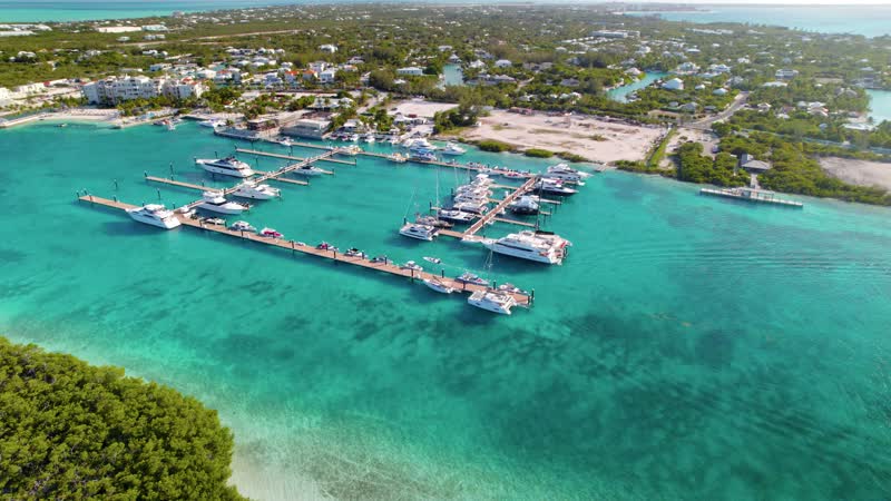 Drone shot of small boat entering Blue Haven Marina