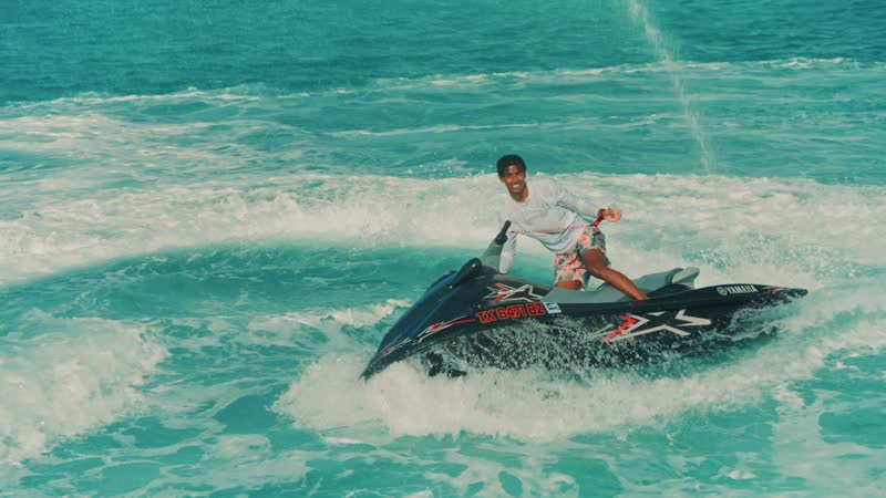 Handheld shot of tourist aggressively riding jetski