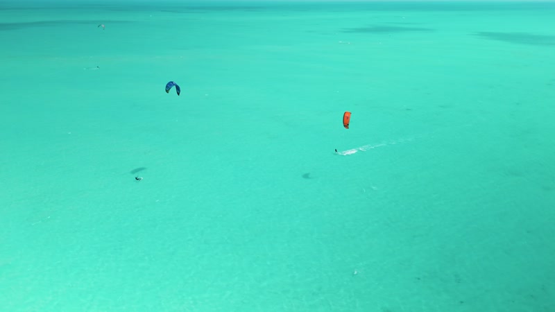 Drone shot of kitesurfers in Long Bay