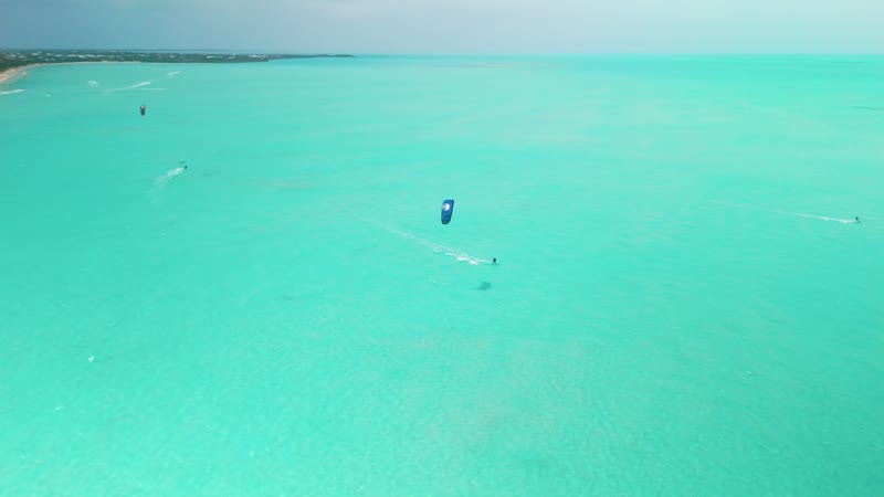 Drone shot of kitesurfers in Long Bay