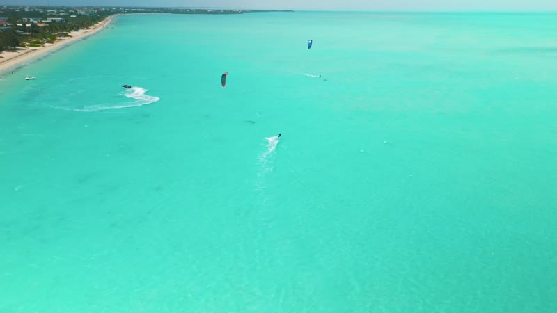 Drone shot of kitesurfers in Long Bay