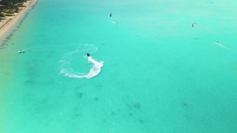 Drone shot of kitesurfers in Long Bay