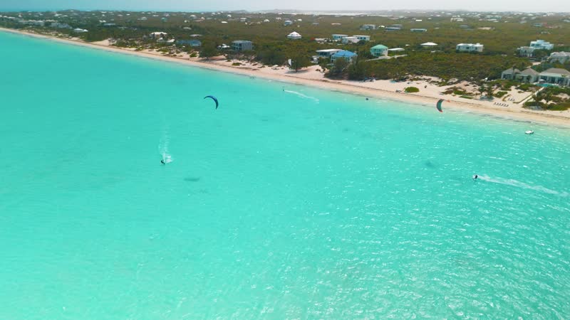 Drone shot of kitesurfers in Long Bay
