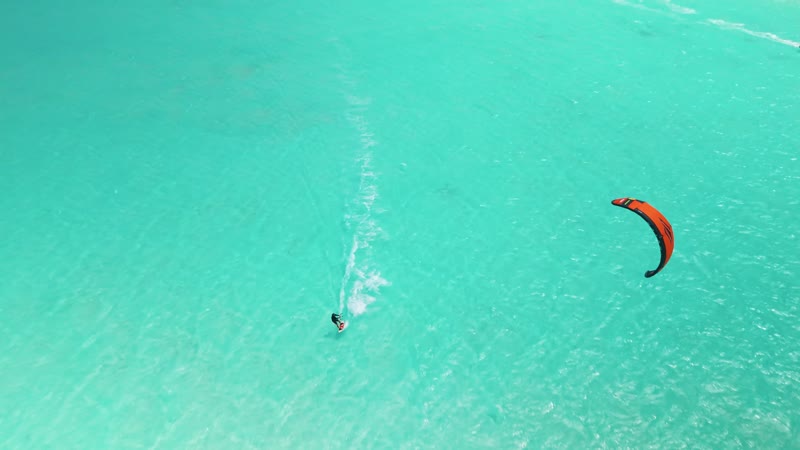Drone shot of kitesurfers in Long Bay