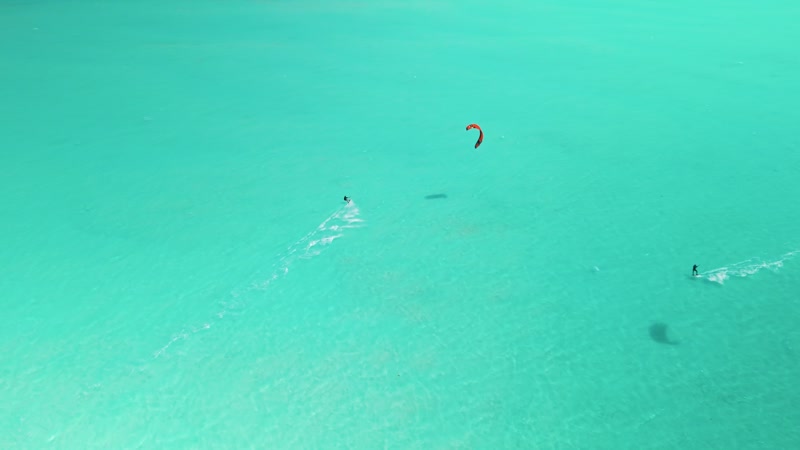 Drone shot of kitesurfers in Long Bay