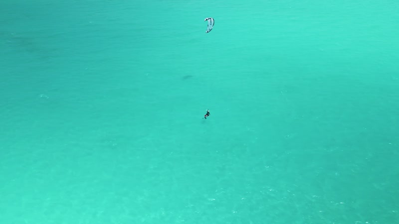 Drone shot of kitesurfers in Long Bay