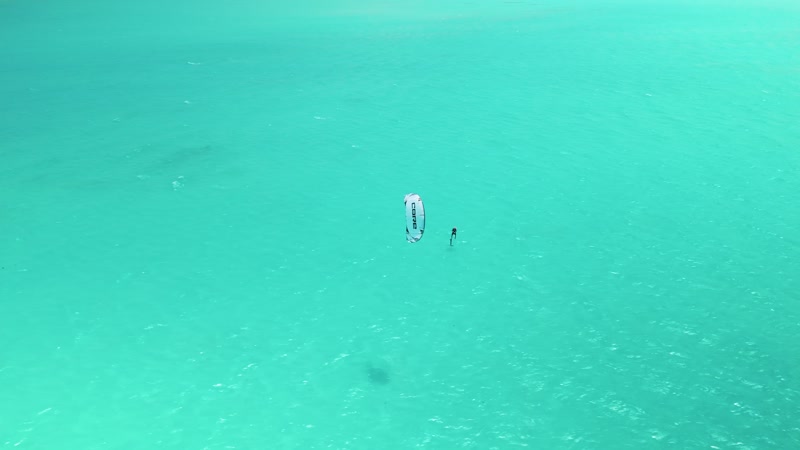Drone shot of kitesurfers in Long Bay
