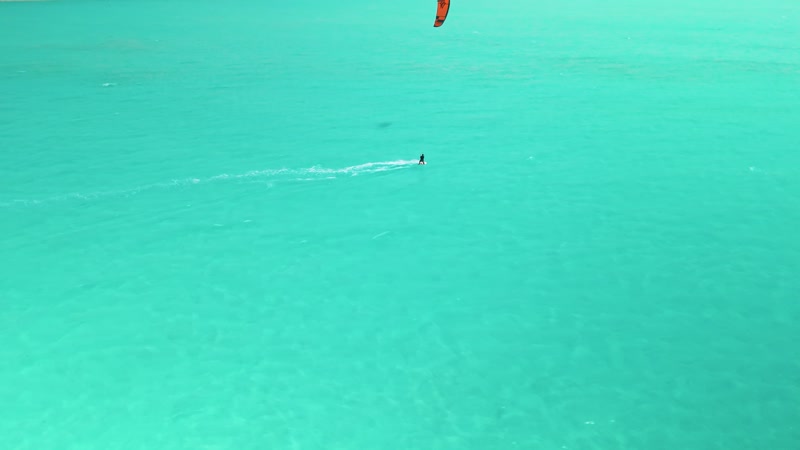 Drone shot of kitesurfers in Long Bay