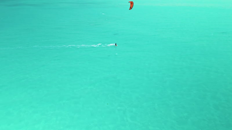 Drone shot of kitesurfers in Long Bay